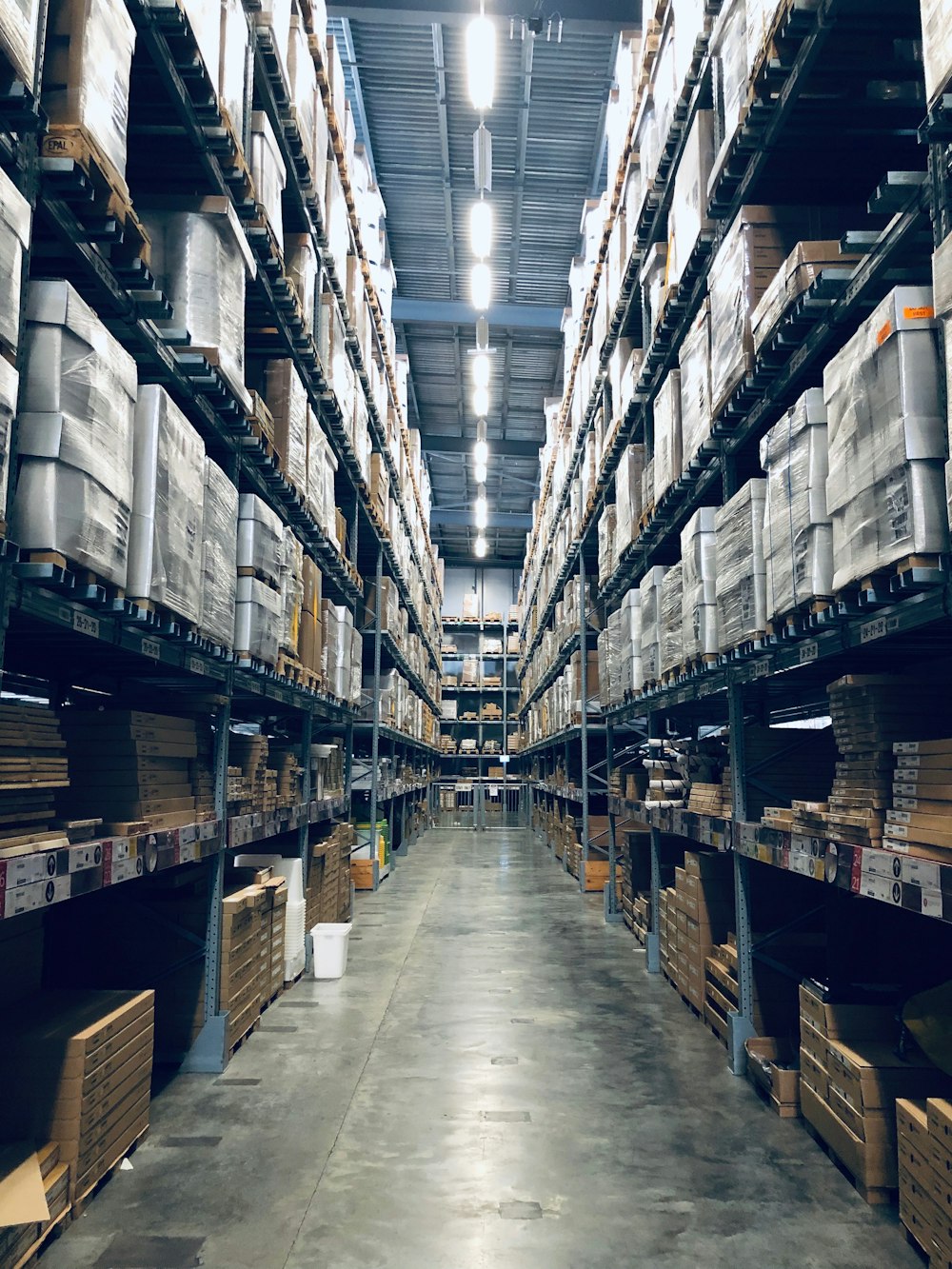 Warehouse shelves stacked with business stock