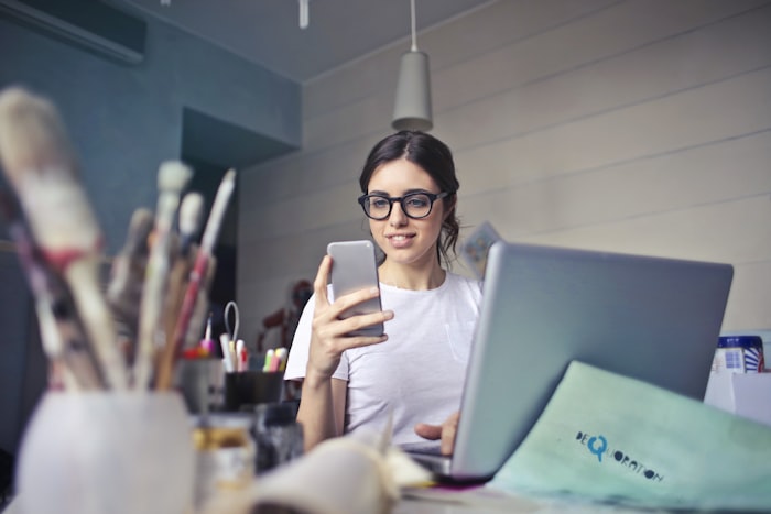 Person working out costs on a laptop